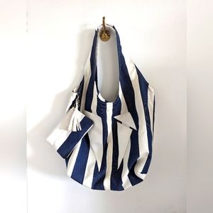 Beach bag with wallet and tassle .   Large and roomy for your accessories